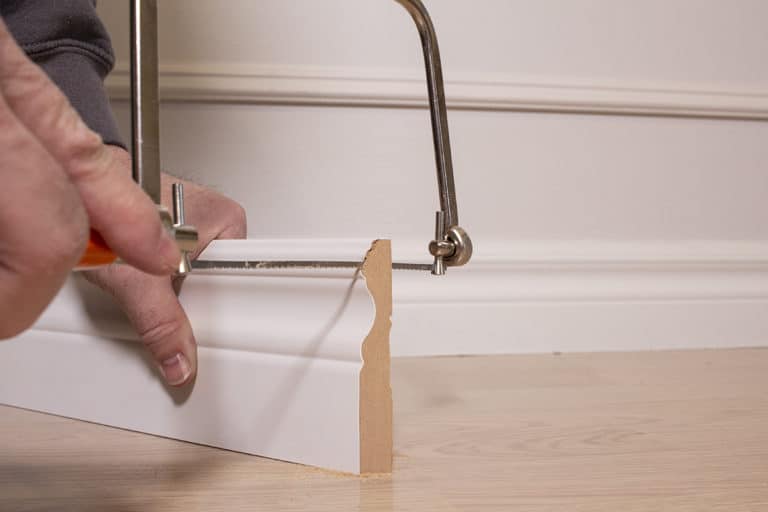 How to Install Baseboards, Plus How to Caulk Them Easily