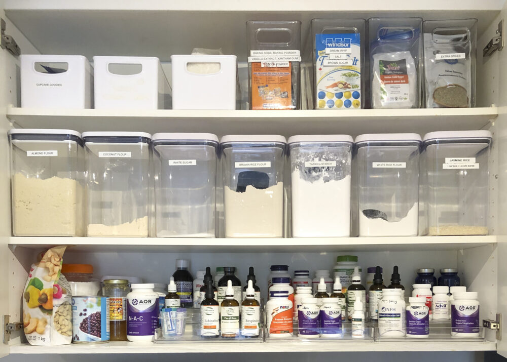 canisters in the cupboard and shelf risers for vitamins
