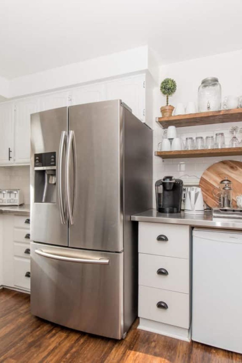 A farmhouse-style kitchen with stainless steel appliances. The link leads to "Fridge Organization Tips: Ideas to Simplify Your Life" on HomeMadeLovely.com.