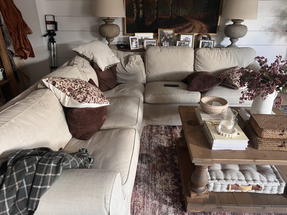 messy pillows and blankets in the living room to illustrate reasons your home never stays tidy when asking why is my house always messy