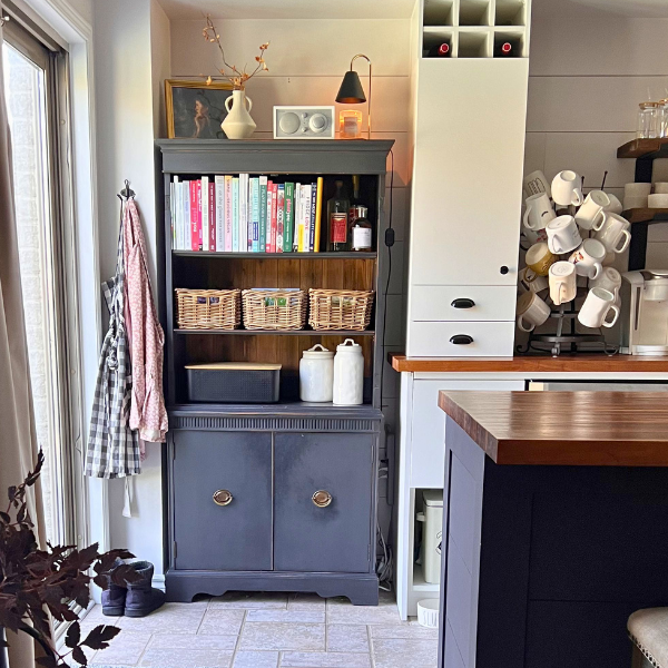 organized black kitchen cabinet to show organizing personalities